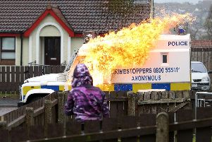 A PSNI vehicle is attacked with a petrol bomb during public disorder in Londonderry last April. Archive pic by Kelvin Boyes / Press Eye