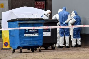 Police and forensic officers pictured at the scene where a body of a man was found in the Keylands Place area on Friday afternoon.'Mandatory Credit Presseye /Stephen Hamilton