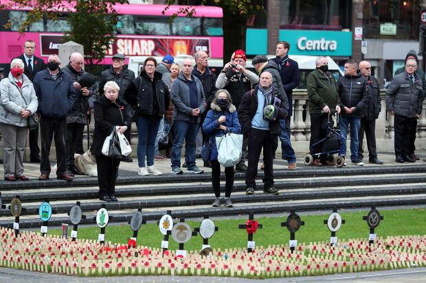 People during a two-minute silence at City Hall, Belfast, for Armistice Day (PressEye/PA)